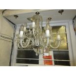Pair of small moulded glass five light electroliers together with a matching two tier chandelier