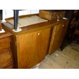 1970's Walnut semi bow fronted sideboard having two flush panelled doors on low tapering swept