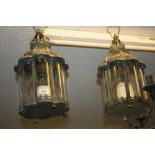 Two modern patinated metal hanging lanterns