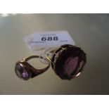 Large 9ct gold amethyst set dress ring together with a similar smaller dress ring