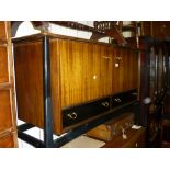 1970's G-Plan ebonised and mahogany sideboard having two flush panelled doors above two drawers