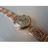 Ladies 9ct gold wristwatch with an ornate 9ct gold bracelet strap