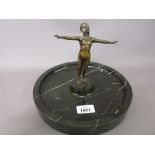 Art Deco brown patinated bronze figure of a nude girl mounted on a circular marble base