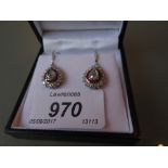 Pair of 18ct white gold ruby and diamond drop earrings, the central rose cut diamonds,