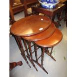 20th Century mahogany nest of three oval occasional tables on slender turned supports together with