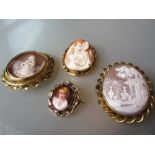 Group of three 19th Century gilt metal mounted carved shell cameo brooches of a kneeling figure,