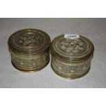 Pair of 19th Century French circular embossed brass tobacco boxes
