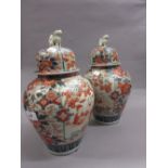 Pair of Imari pattern baluster form vases and covers,