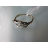 1930's 9ct gold and platinum three stone diamond ring