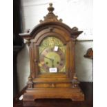 German walnut cased mantel clock with brass dial and two train movement striking on a gong