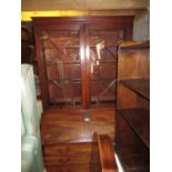 George III mahogany bureau bookcase, the moulded cornice above a pair of bar glazed doors,