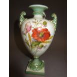 Royal Worcester baluster form two handled pedestal vase painted with flowers within green border, 5.
