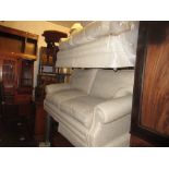 Pair of modern beige upholstered two seater sofas