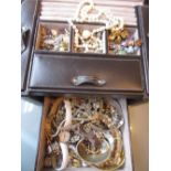 Brown jewellery case containing simulated pearl necklaces,