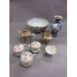 Group of three Chinese export covered cups with painted floral decoration,