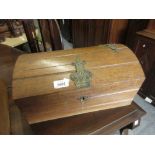 Early 20th Century oak and brass mounted casket with a dome shaped lid