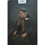 Pair of Victorian overpainted photographs of a seated lady and gentleman in ornate gilt frames,