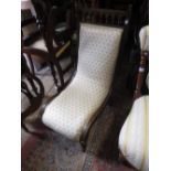 Victorian oak and upholstered nursing chair together with an Edwardian open elbow chair and an oval