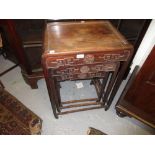 Nest of three Chinese hardwood rectangular occasional tables