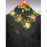 Early 20th Century floral embroidered black silk shawl together with a blue velvet coat