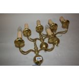 Set of three brass wall lights in antique Dutch style, a small brass lantern,