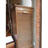 Early 20th Century index cabinet with a tambour door enclosing shelves