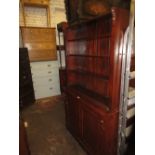 Victorian mahogany bookcase with open shelves above two cupboard doors (minus cornice)