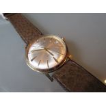 Garrard gentleman's circular gold wristwatch with leather strap