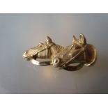 14ct Gold brooch formed as two horses heads