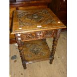 Late 19th or early 20th Century carved oak occasional table with a mask head drawer and barley