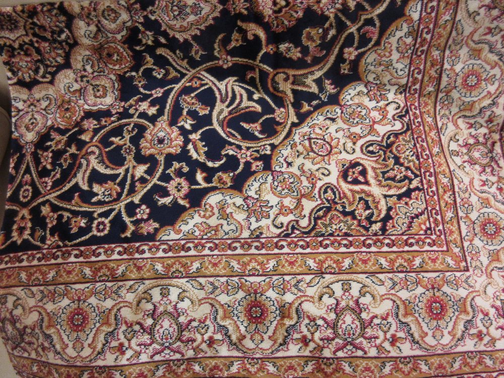 Kashan style machine woven blue ground carpet, 1.90 x 1.