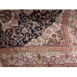 Kashan style machine woven blue ground carpet, 1.90 x 1.