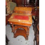 Victorian walnut marquetry inlaid Davenport with a hinged cover above open shelves on turned