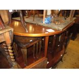 Mid 20th Century circular teak extending dining table with integral leaf by Macintosh