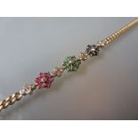 18ct Yellow gold flowerhead bracelet set diamonds, rubies,