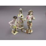 Pair of 19th Century Continental porcelain figures of a lady wearing a headdress and holding a fan