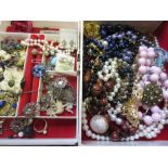 Cream jewellery box containing various costume jewellery
