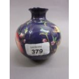 Small 20th Century Chinese porcelain vase decorated with flowers and fruits on a blue ground,