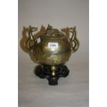 Chinese brass ball form censer with pierced cover,