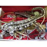 Red jewellery box containing various silver and other jewellery