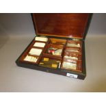 19th Century brass inlaid gaming counter box containing a quantity of various bone and mother of