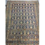 Small Kurdish rug with an all-over stylised design on a blue ground,