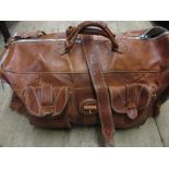 Leather bag containing various table linen,