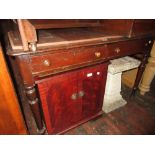 Late 19th Century desk having two drawers with knob handles raised on turned tapering supports