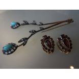 Pair of 14ct gold garnet set ear clips together with a turquoise and paste hair ornament