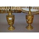 Pair of mid 20th Century gilt metal baluster form lamp bases decorated in relief with cherubs