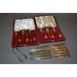 Two cased sets of six silver coffee spoons,