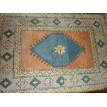 20th Century Turkish rug with a single medallion design on an ivory ground with blue border,