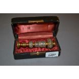 Ornate gilt and silvered metal seal in a fitted case