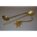 Two large brass ladles and a brass bracket